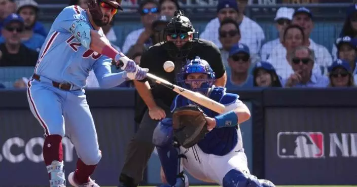 Kyle Schwarber going back to Phillies on a $150 million, 5-year contract, AP source says