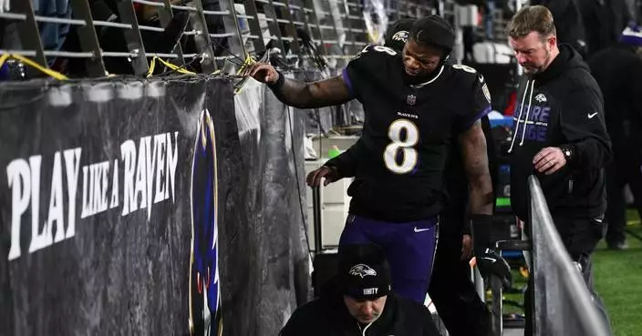 Ravens' Lamar Jackson leaves in the 2nd quarter against Patriots with a back injury