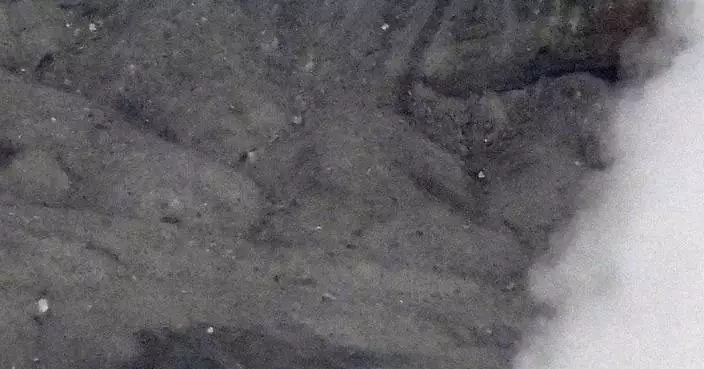 Rescuers spot wreckage possibly from a helicopter that went missing near a volcano in Japan