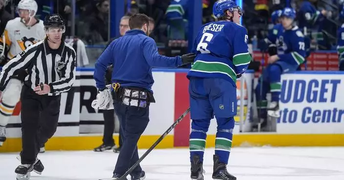 Canucks place winger Boeser and defenseman Buium on injured reserve