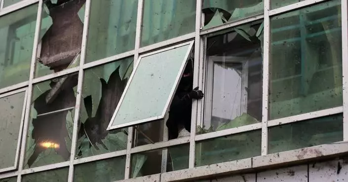 Islamic State group claims attack on a Kabul restaurant that killed 7, including a Chinese national