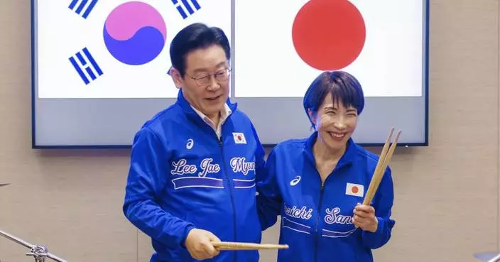 Japanese and South Korean leaders jam to K-pop hits at a summit