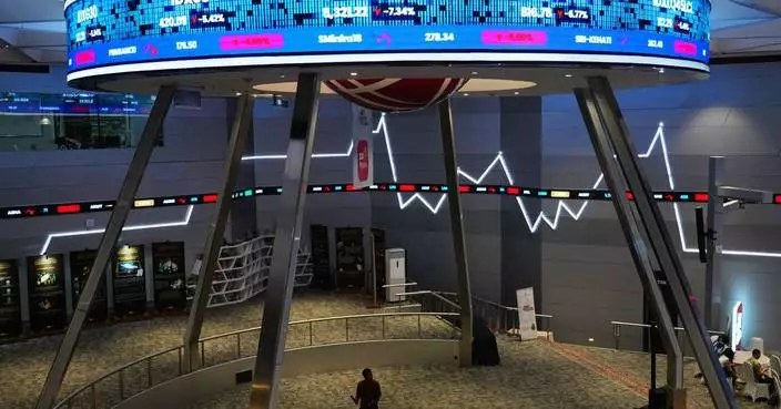 Asian shares mostly fall and gold jumps more than 4% after the Fed keeps rates unchanged