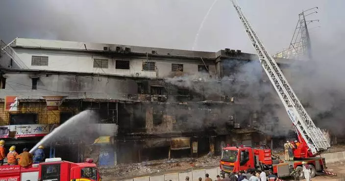 Death toll in Karachi shopping plaza fire rises to 10 as search continues for dozens missing