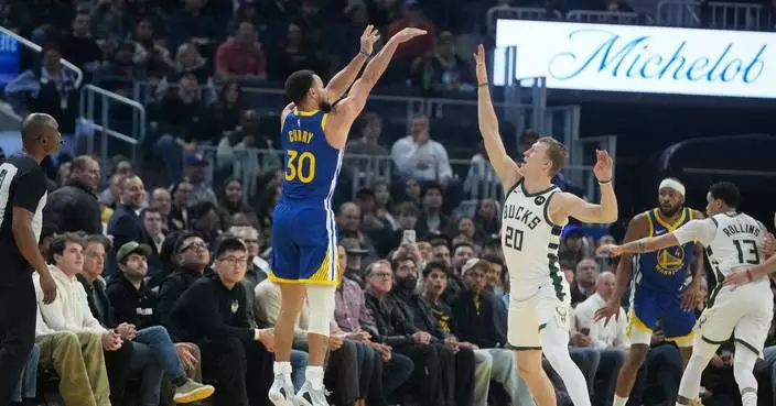 Stephen Curry, Jimmy Butler lead Warriors past Bucks, 120-113