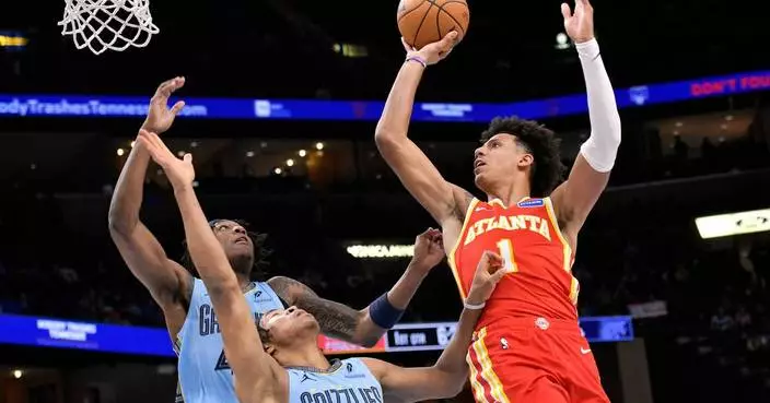 Jalen Johnson has 32 points, 15 rebounds to lead the Hawks to a 124-122 victory over the Grizzlies