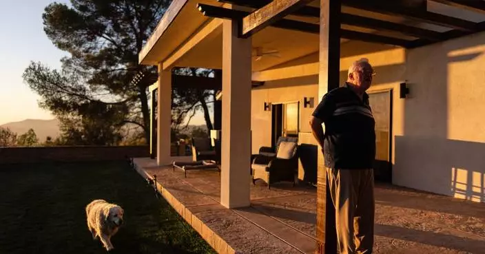 A man and his old dog are home at last after fleeing LA area fires