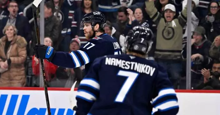 Lowry, Connor each have goal and assist as Jets beat Islanders 5-4 for their 3rd straight win