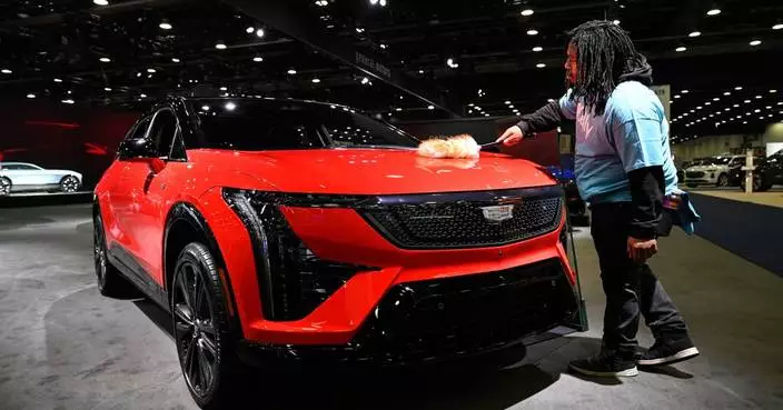 At Detroit auto show, spotlight dims for EVs