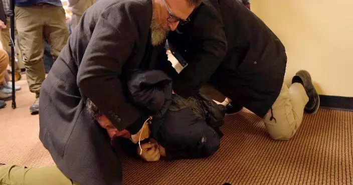 Man tackled to ground after spraying unknown substance on Rep. Ilhan Omar at Minneapolis town hall