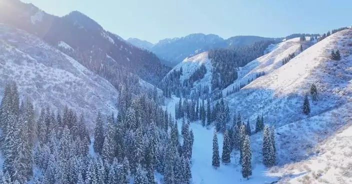 Aerial footage records snowy Tianshan Mountains of Xinjiang