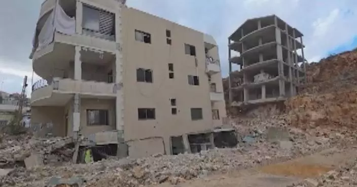 Families flee from homes in southern Lebanon as Israeli airstrikes level residential buildings, shops