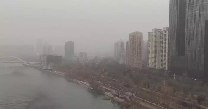 Cold air brings strong winds, sand, dust to northwest China