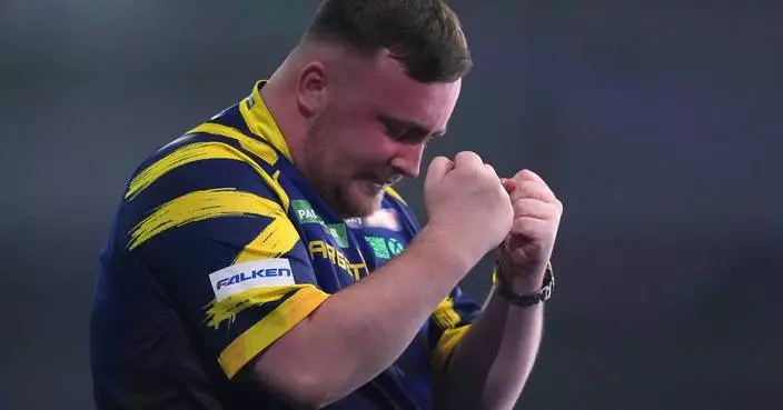 Littler wins back-to-back world darts titles at 18