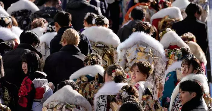 Photos of 20-year-olds gathering in kimonos for Coming of Age Day ceremony in Japan