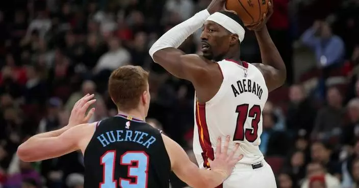 Powell scores 21 points and Heat outlast Bulls for 116-113 win