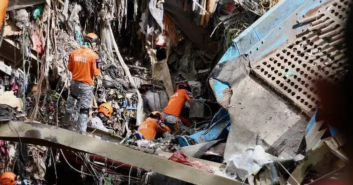 Filipino rescuers detect ‘signs of life’ in garbage avalanche that killed 4 and left dozens missing