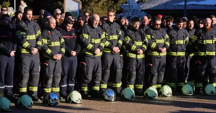 Hundreds march in silence to honor victims of Swiss bar fire that left 40 dead