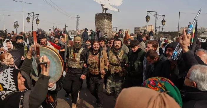 UN aid convoy delivers supplies to besieged city in northeast Syria as a shaky ceasefire holds