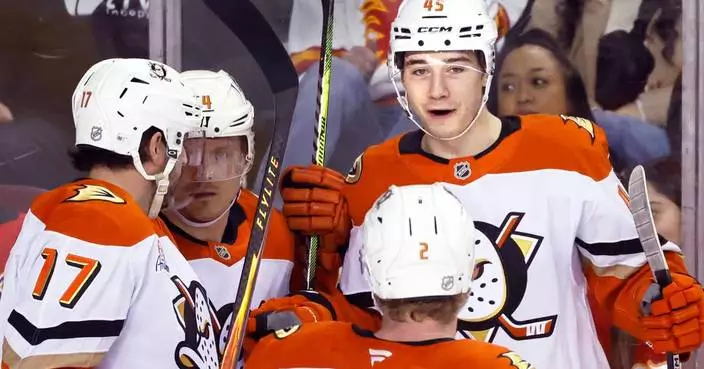 Sennecke scores in OT for 1st NHL hat trick as Ducks rally to beat Flames 4-3