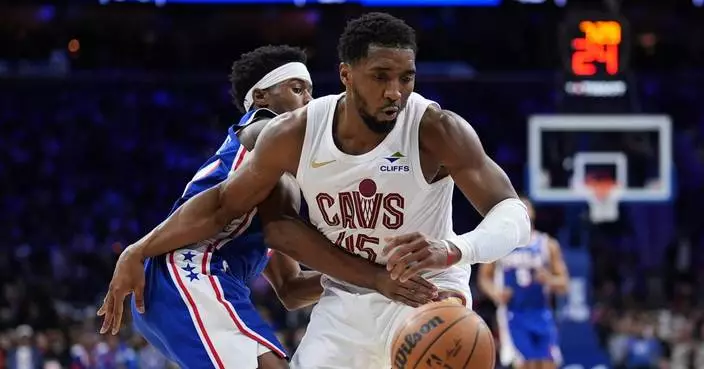 Mitchell has 35 points to power Cavs past 76ers 133-107 but Garland exits with foot injury