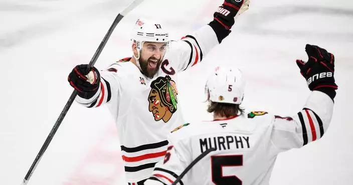 Moore and Murphy help the Blackhawks beat the Blues 7-3 for their 4th straight win