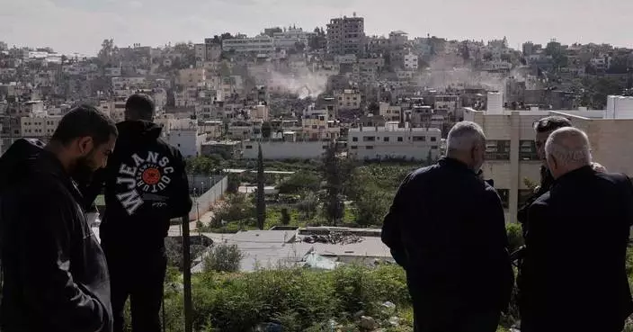 Palestinians watch as Israeli bulldozers claw down their West Bank homes
