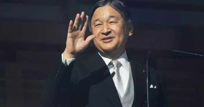 Japan's emperor and his family greet New Year well-wishers