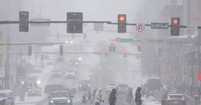 People brace themselves for the winter storm moving across the US, in photos