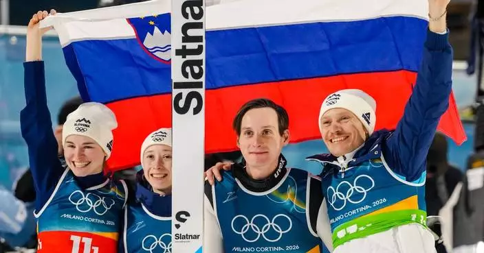 Slovenian siblings Domen and Nika Prevc win Olympic gold in ski jumping team event