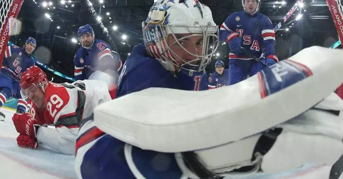 American Jeremy Swayman allows a long-distance goal against Denmark at the Olympics