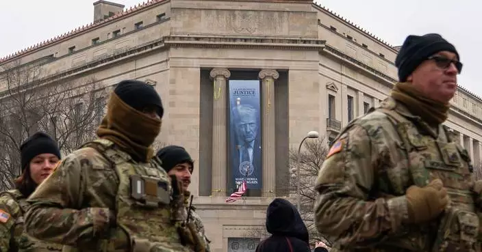 Large banner featuring Trump's face is displayed on Justice Department headquarters