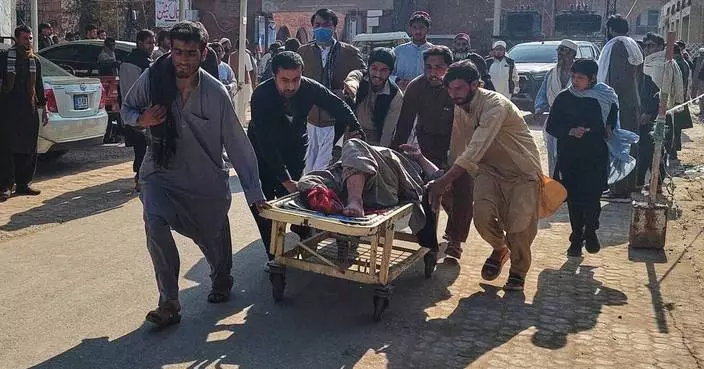 Motorcycle bomb at police station kills at least 2 and wounds several in northwestern Pakistan