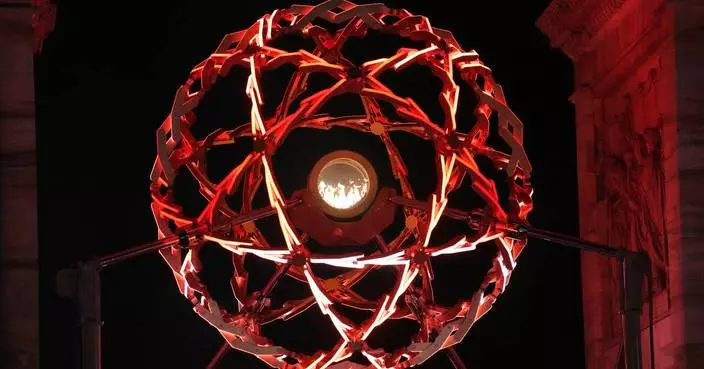 Milan's nightly Olympic cauldron light show draws thousands to Arch of Peace