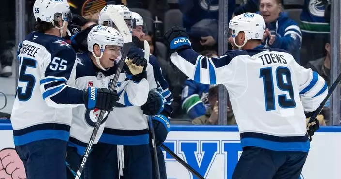 Cole Perfetti scores in overtime in the Jets’ 3-2 victory over the Canucks