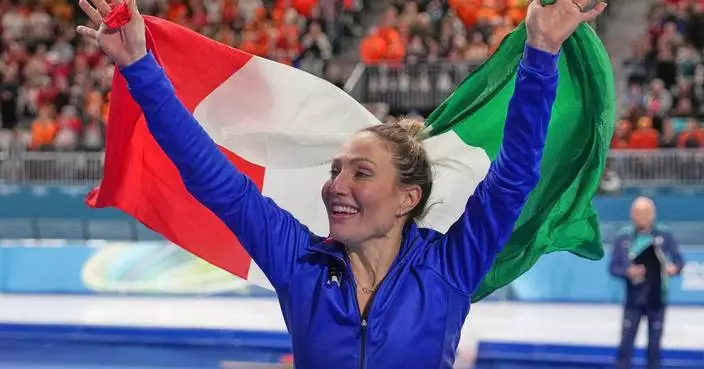 Francesca Lollobrigida hugs her son after winning Italy's first gold of the Milan Olympics