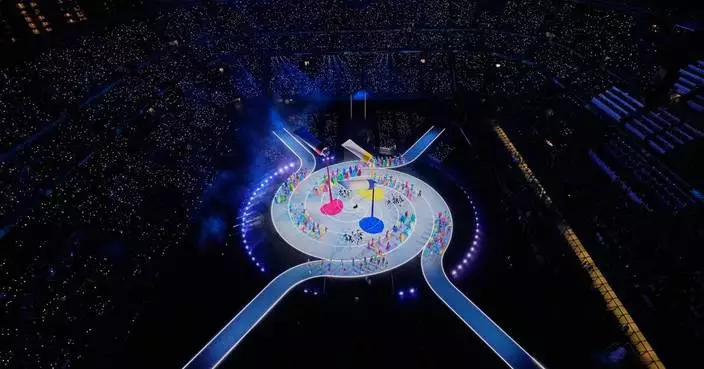 The Latest: Milan Cortina Winter Olympics kicks off with a four-site, two-cauldron opening ceremony