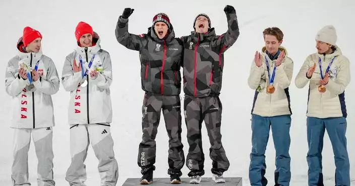 Austria wins gold in 1st Olympic men’s super team ski jump as event is shortened due to weather