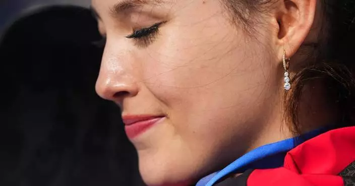 Eileen Gu in tears after defending her Olympic halfpipe title, learning of her grandmother’s death