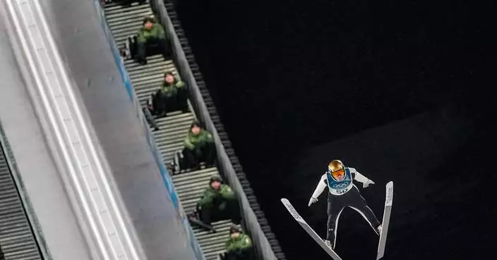 Slovenia’s Domen Prevc lands big ski jump to capture gold on large hill at Milan Cortina Games