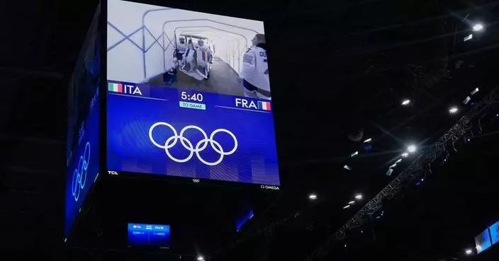 Goaltenders get golf cart rides to the ice for hockey games at the Milan Cortina Olympics