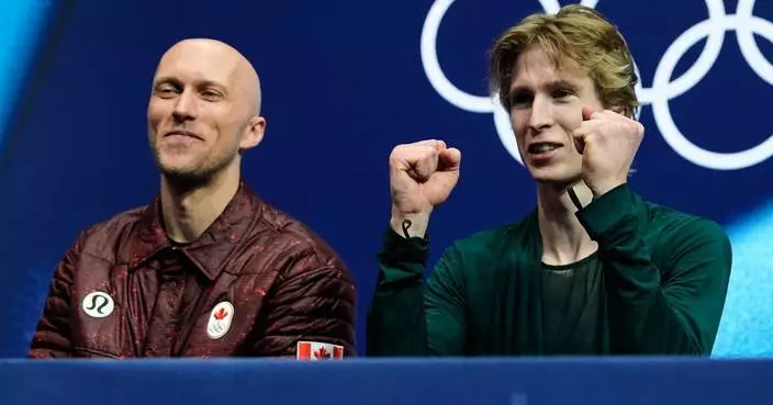 French skating coach grabs spotlight with jacket swaps at Olympics
