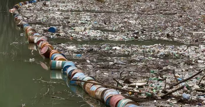 Photos show workers clearing waves of trash from Bosnia’s Drina River
