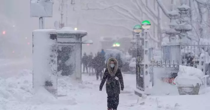 The Latest: Snowfall intensifies in Northeast as many are under blizzard warnings and travel bans