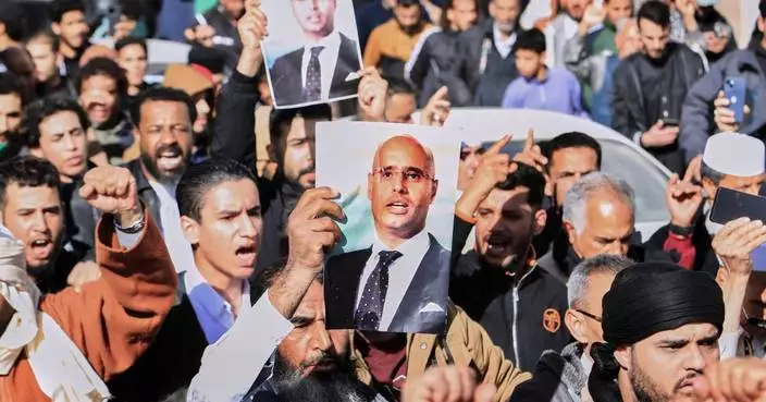 Thousands of Libyans gather for the funeral of Gadhafi’s son who was shot and killed this week