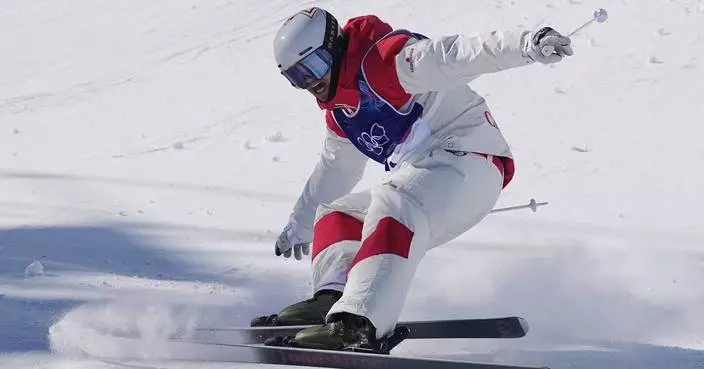 King of the bumps: Kingsbury takes gold in the Olympic debut of men's dual moguls