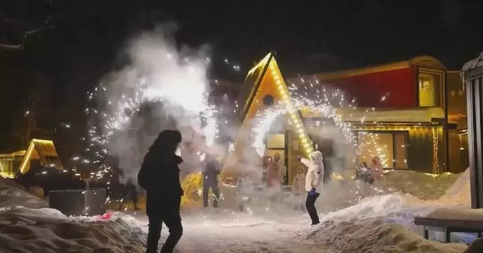 Chinese people enjoy ice-and-snow activities amid dense festive atmosphere