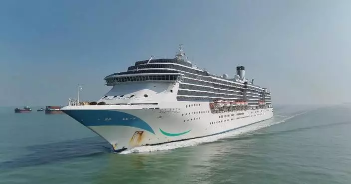Tourists enjoy colorful Chinese New Year cruise voyage at sea