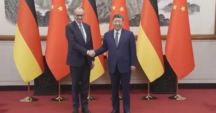 Xi meets German chancellor in Beijing