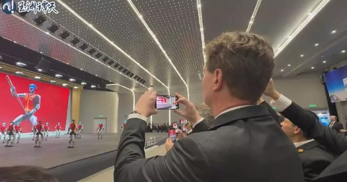 German chancellor, CEOs laud robotics showcase during Hangzhou visit